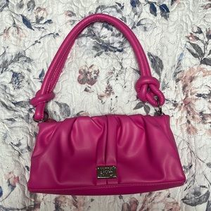 I am selling a madden NYC, mini hot pink bag